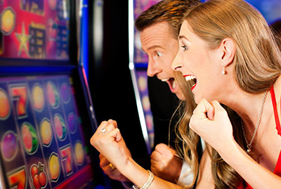 Tourist Playing Slot Machine in Laughlin