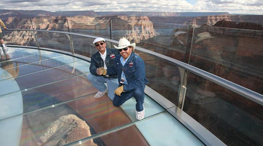 Bill and Guide on Skywalk with views of Grand Canyon