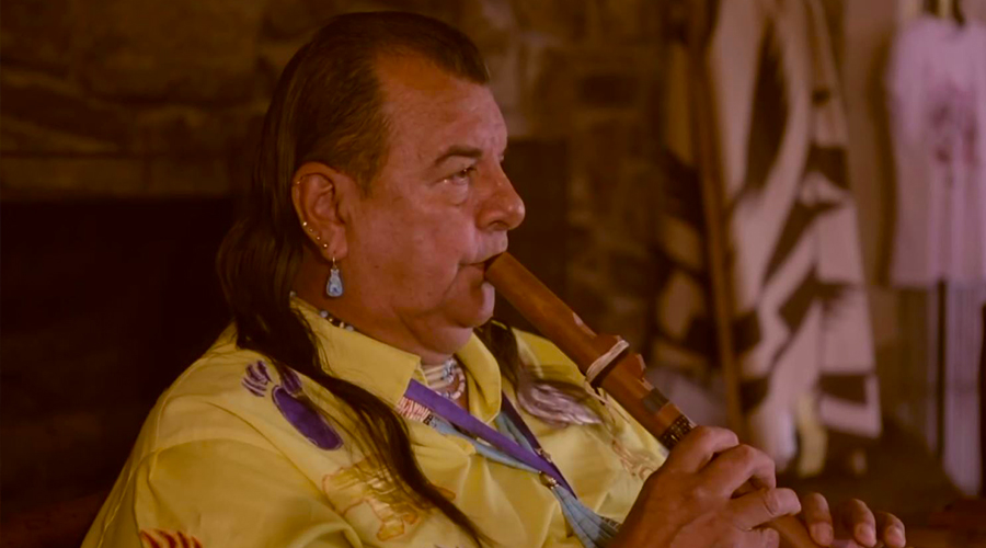 Hualapai Indian playing a flute